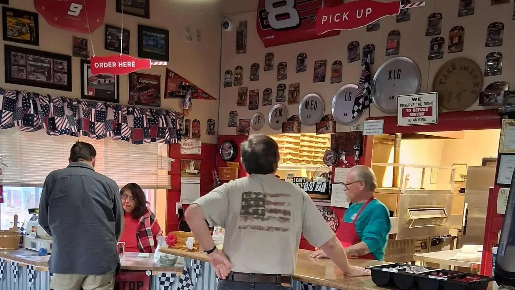 Jim and Pat Dailey welcoming customers to Pit Stop Pizza in Heber-Overgaard, AZ..