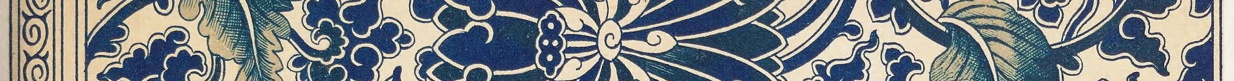 Close-up view of an intricate blue and off-white patterned textile with floral and leaf motifs.