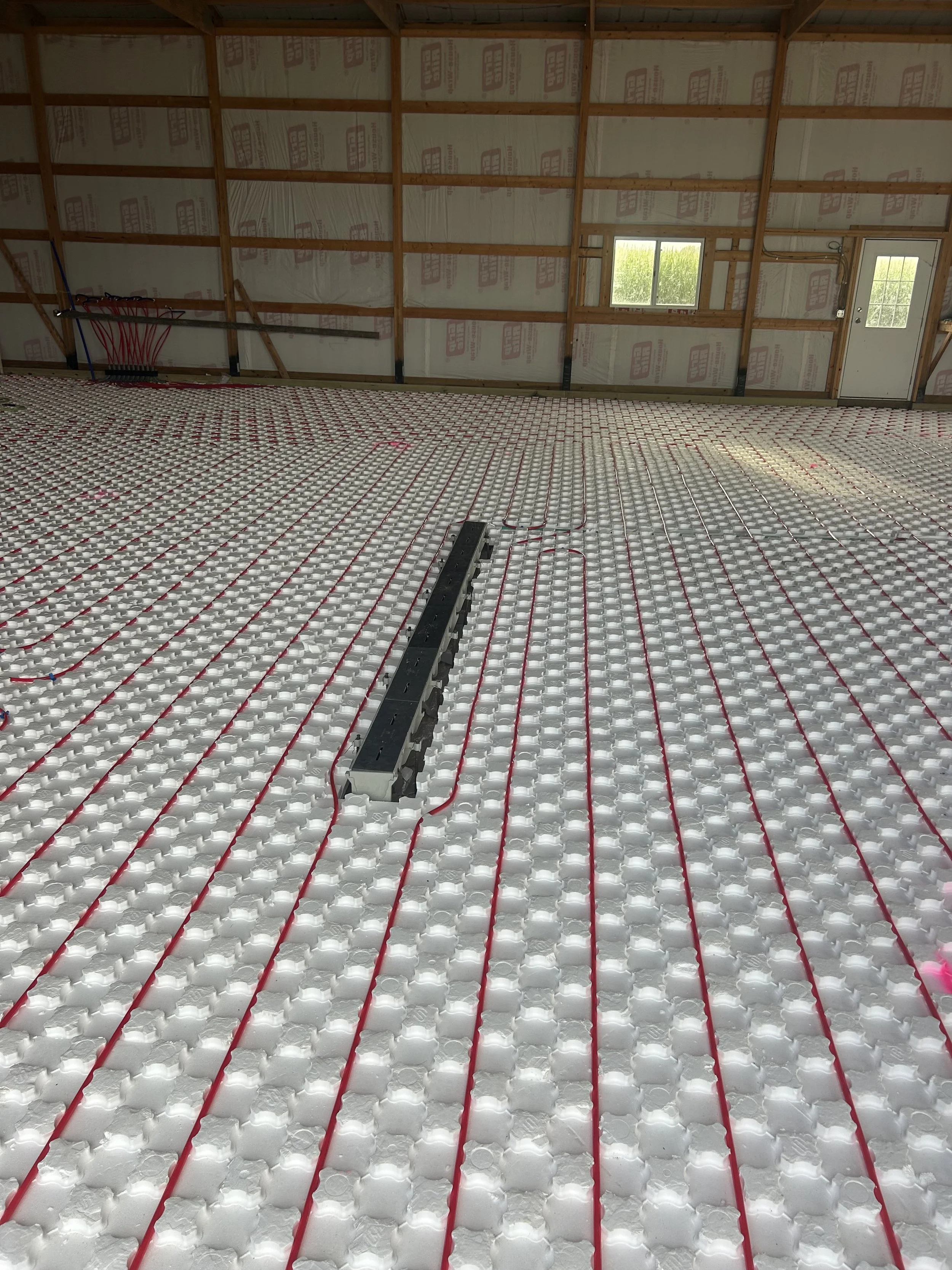 In-floor heat going down in an out-building.
