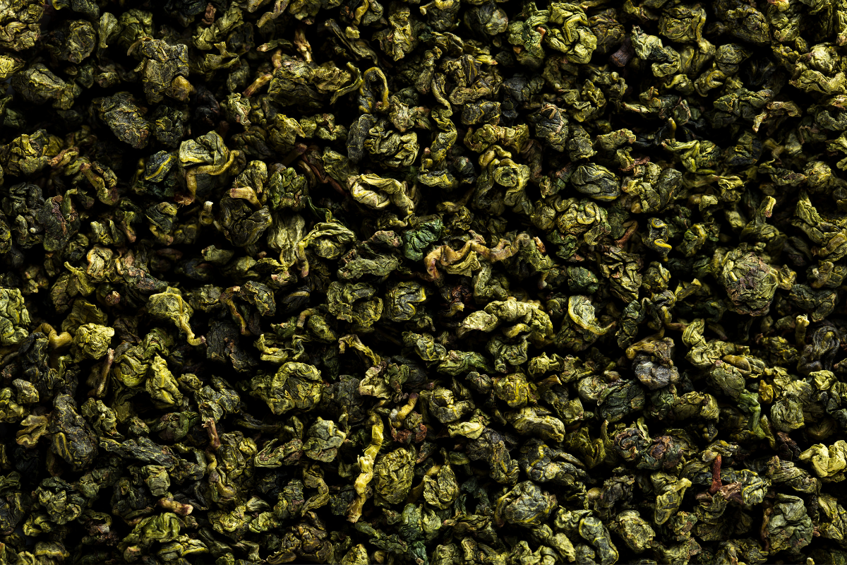 Close-up of dried, crumpled green tea leaves.