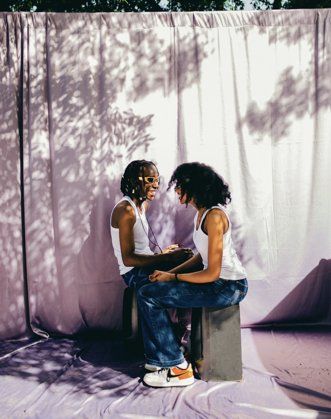 Two women connecting and sharing representing the clarity and relief entrepreneurs feel when they finally identify the hidden subconscious patterns blocking their business growth