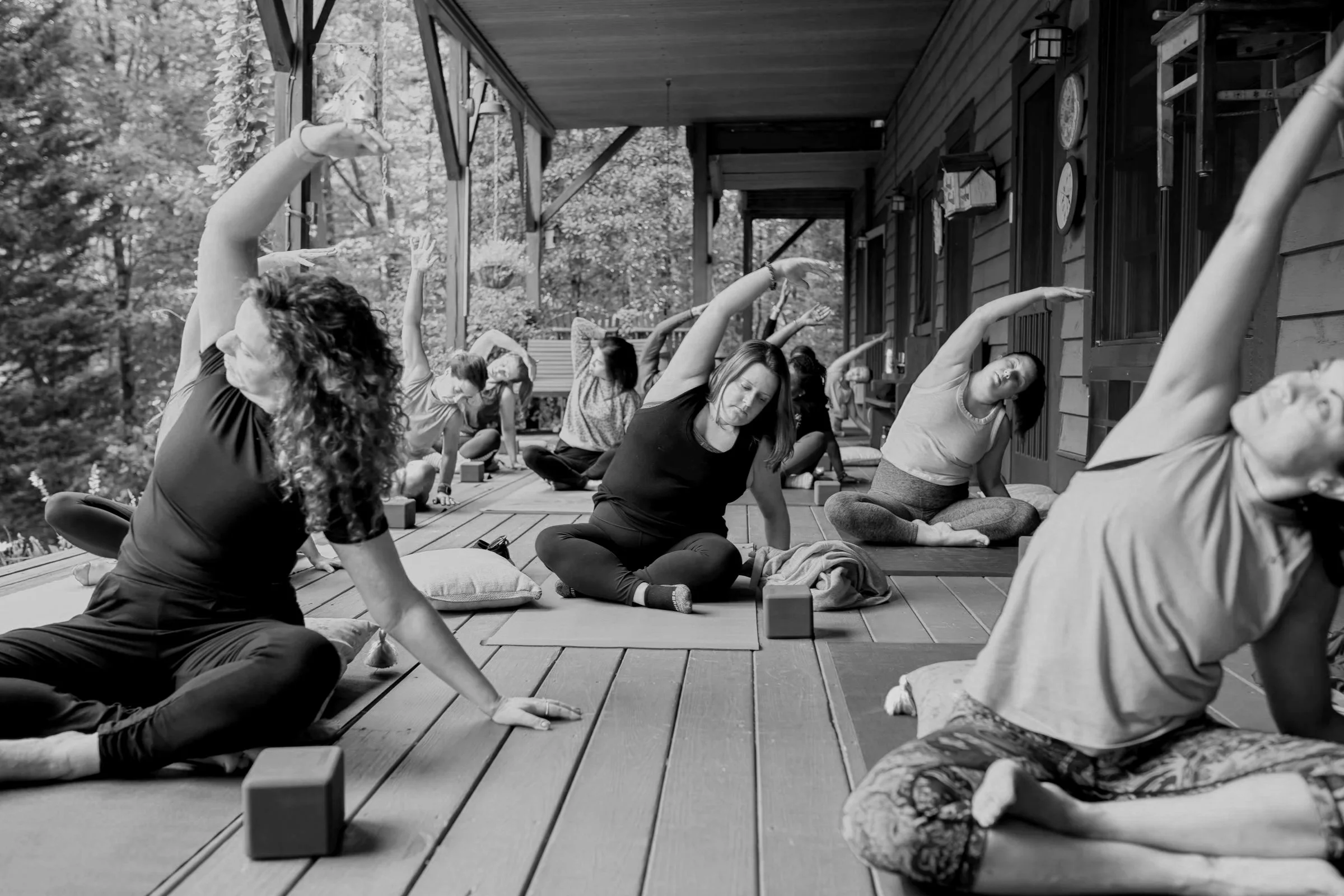 People of all ages, experience levels, and body sizes practicing yoga together during a private birthday retreat. This personalized outdoor group yoga session fosters connection, relaxation, and joyful movement in a welcoming natural setting.