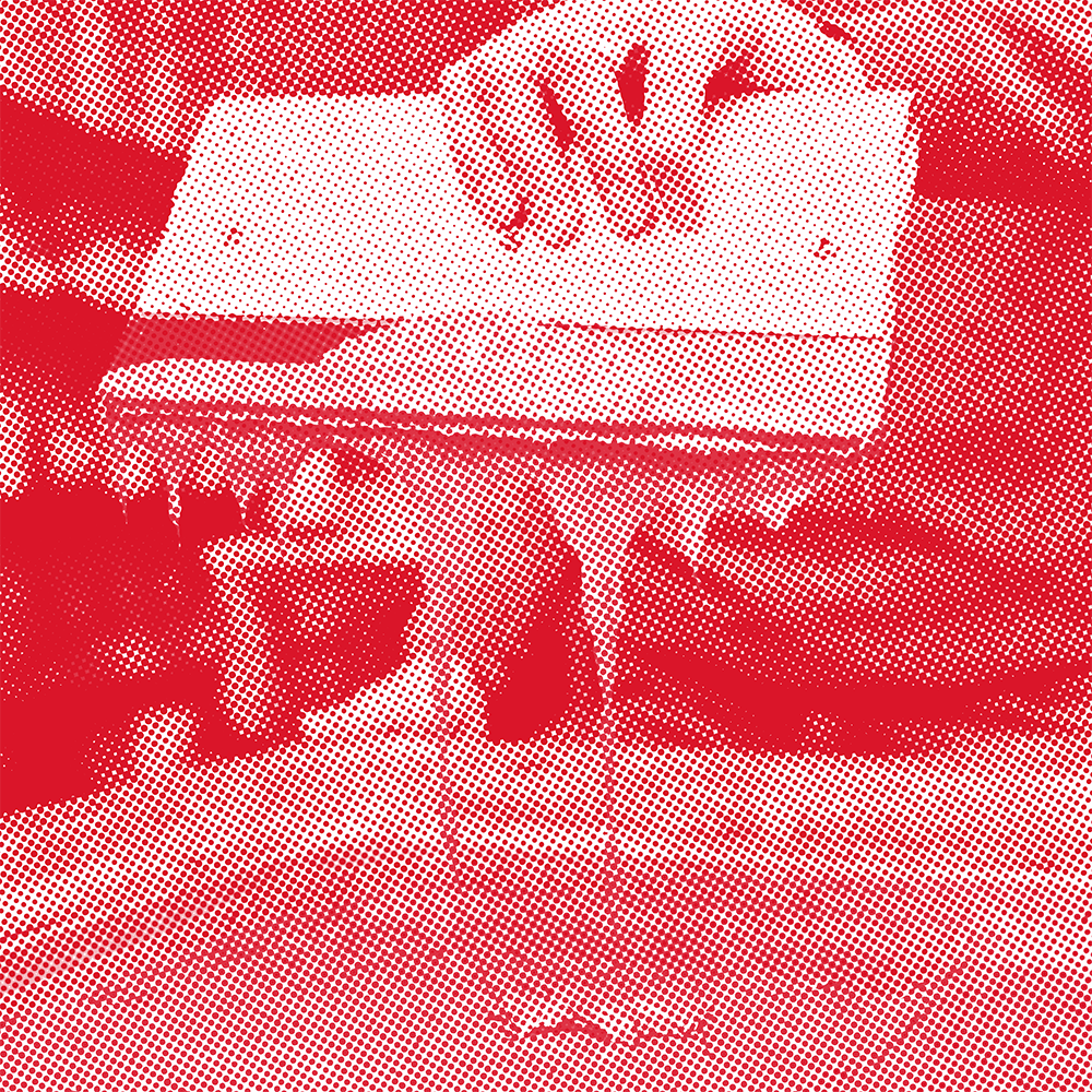 A person holding a screenprinting squeegee.