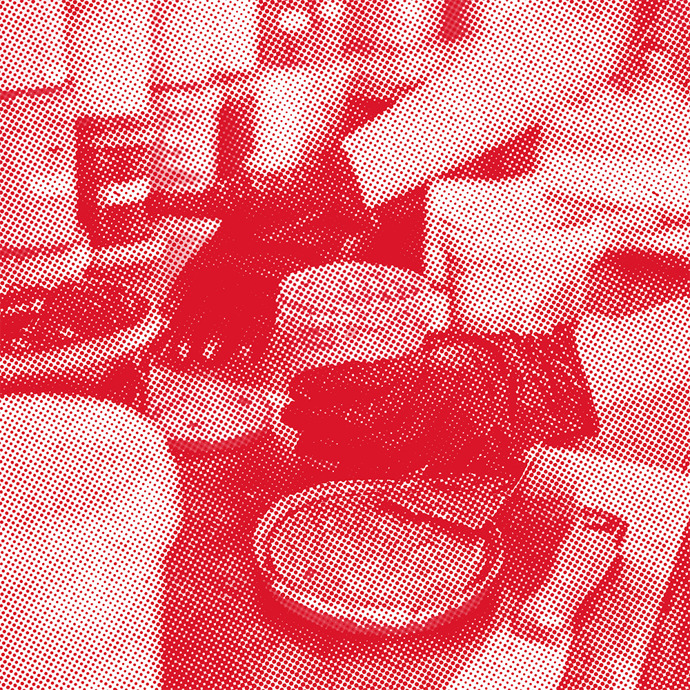 A halftone-style image showing ink being mixed for screenprinting.