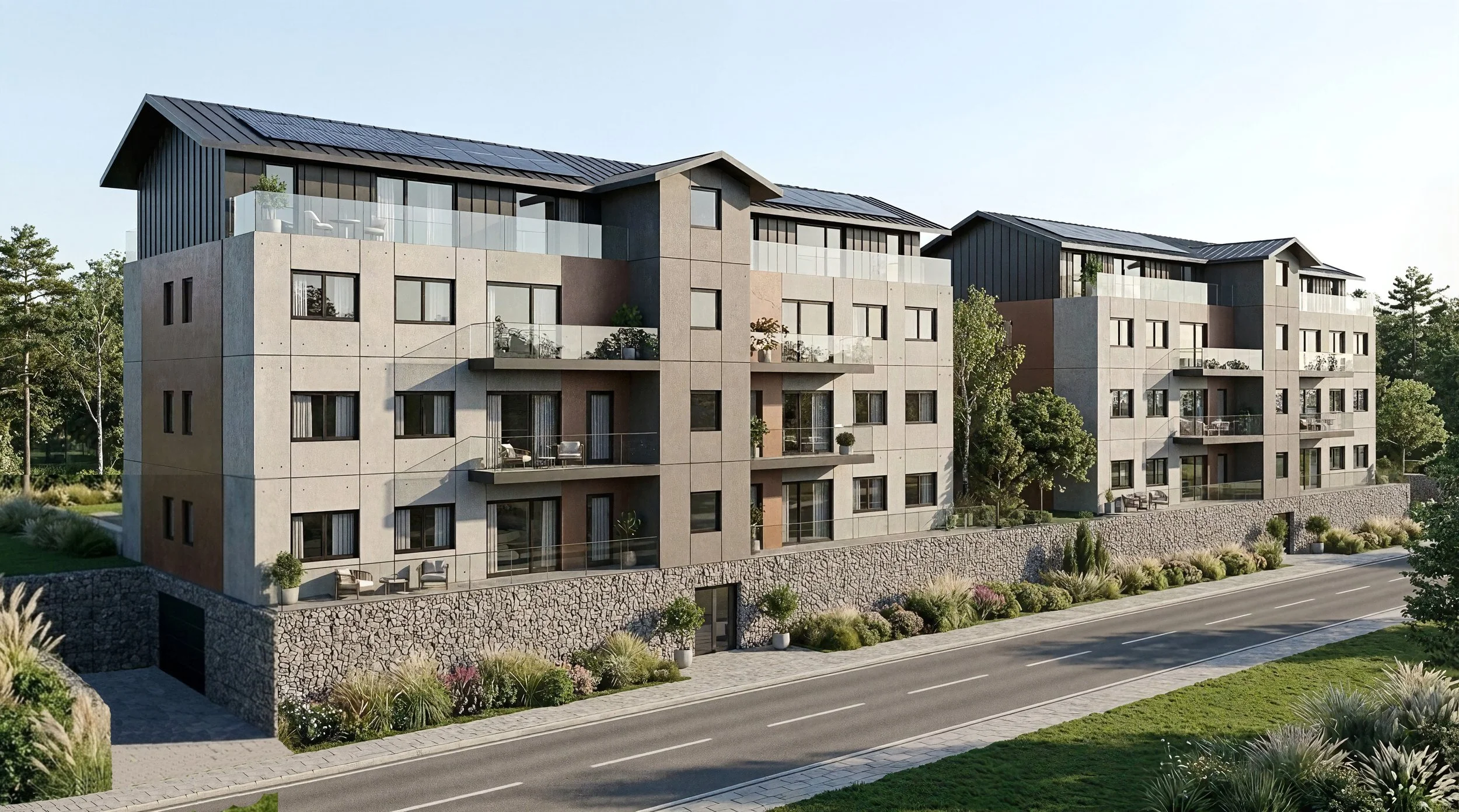 Vista exterior completa de Residencial Mioño Park, con muro de gaviones, ajardinamiento y cubiertas con placas solares, en Mioño, Castro Urdiales