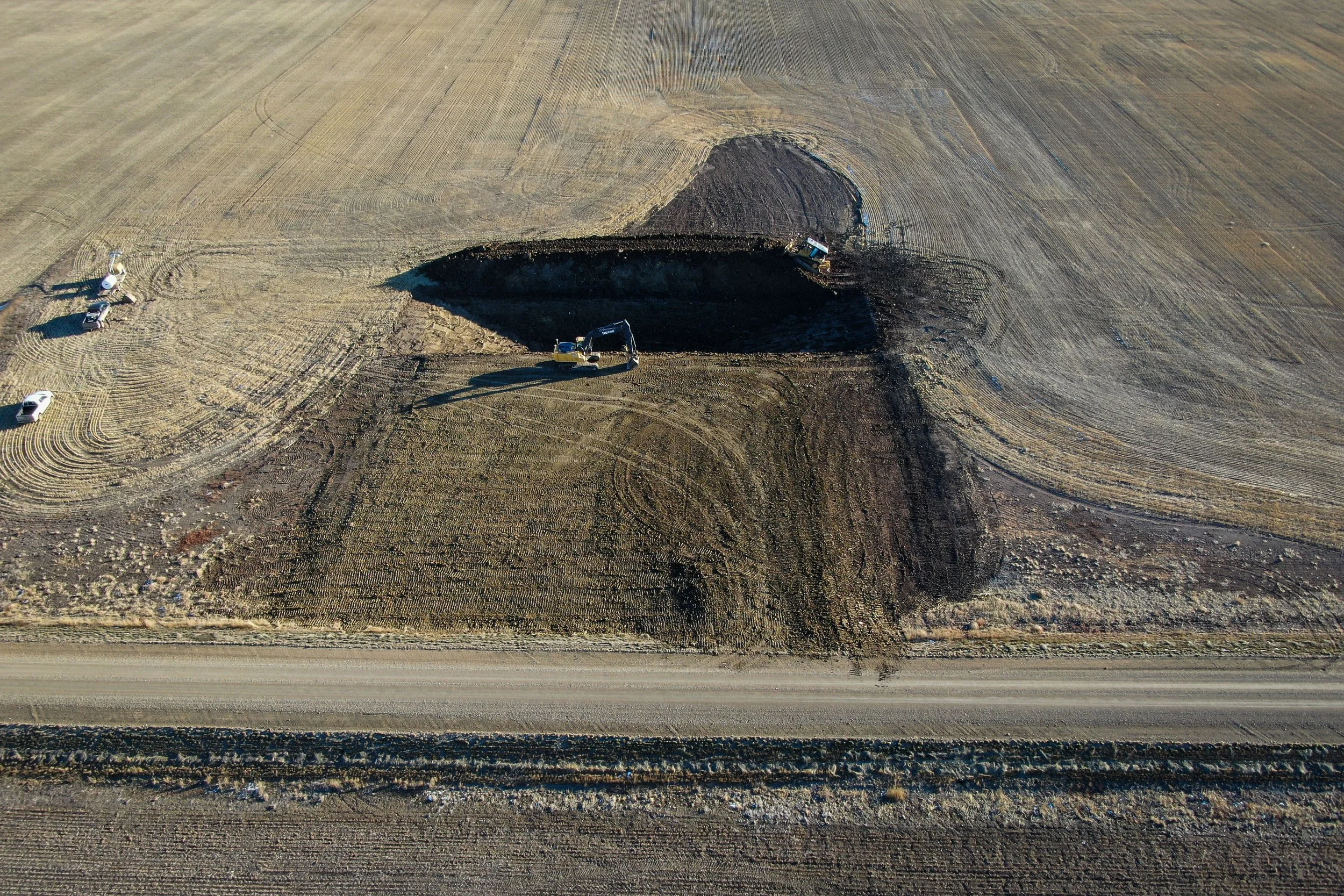 Dugout excavation being completed in rural southern Alberta.