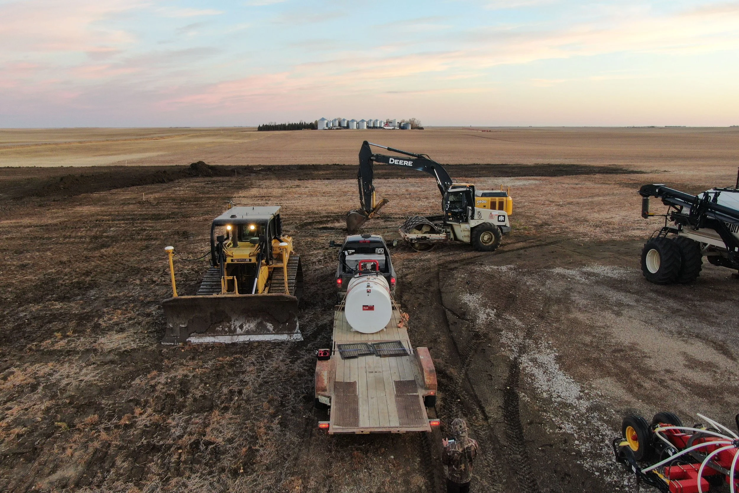 Heavy construction equipment, equipment hauling, rural Alberta.
