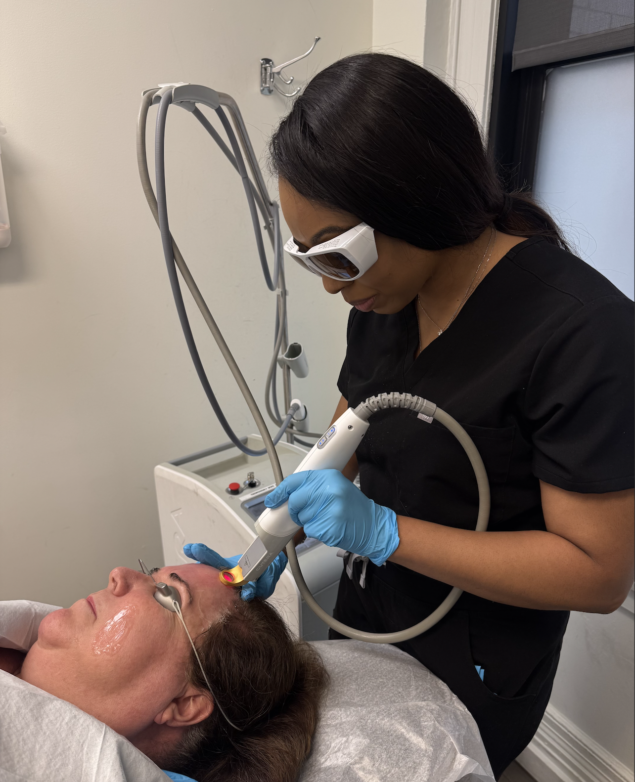 Dr.Brianna performing a medical procedure