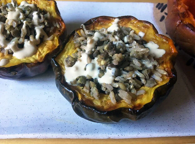 Mujaddara-Stuffed-Acorn-Squash-with-Roasted-Garlic-Tahini-Sauce.jpg