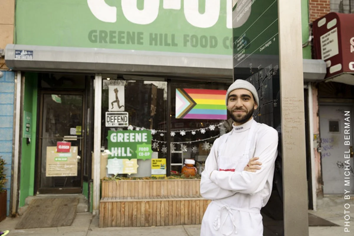 Joel stands in front of the Greene Hill Food Co-op.