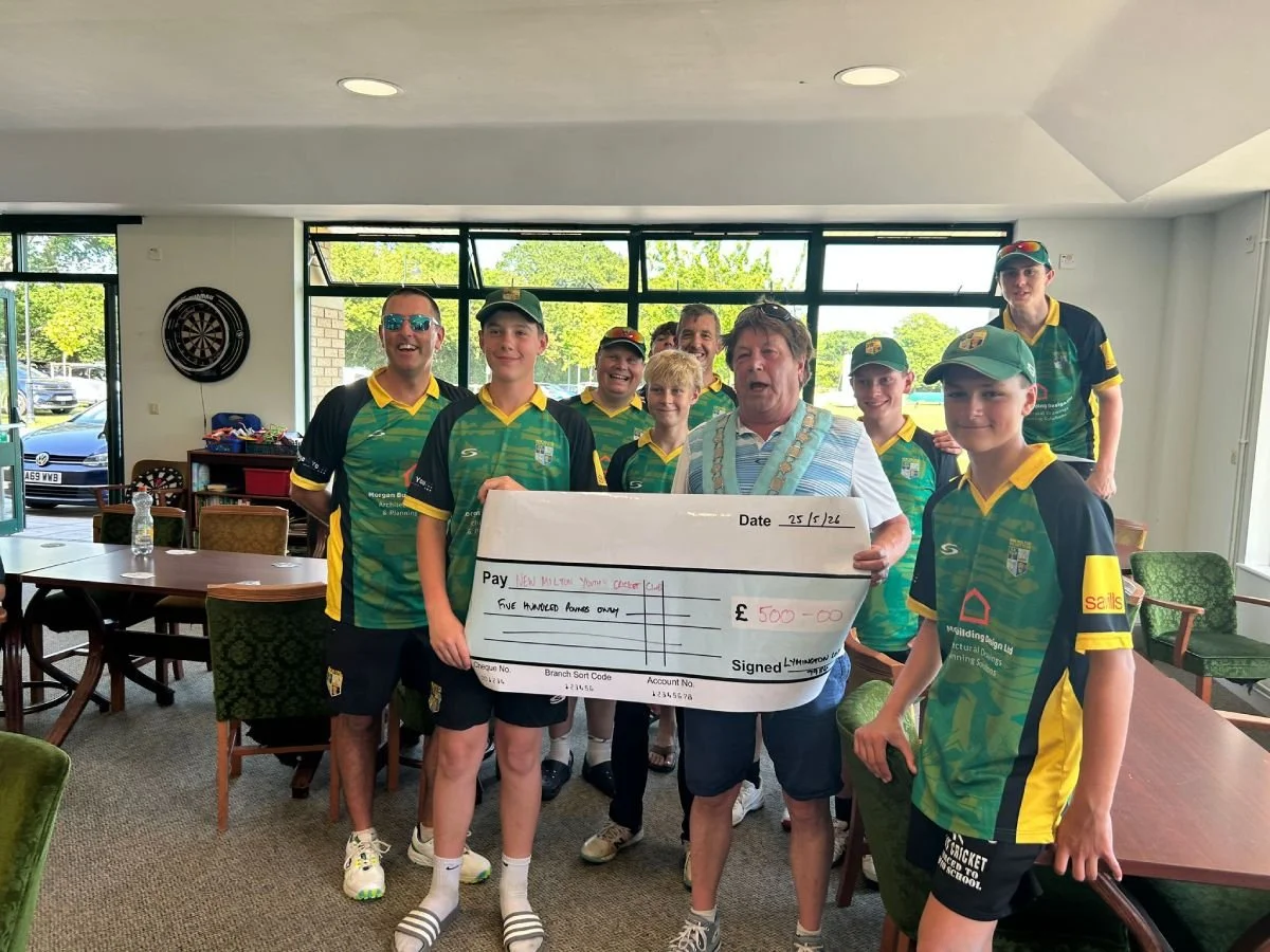 New Milton Cricket Club receiving a donation of £500 for safety equipment