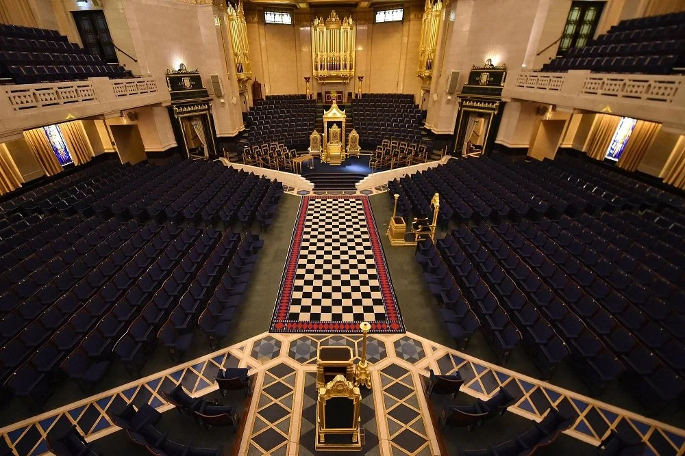 Grand Temple at Freemasons Hall, London, showing the ceremonial hall with checkered floor and seating