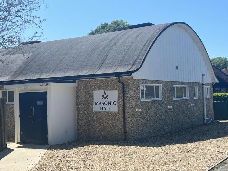New Milton Masonic Hall showing the main entrance and car spaces