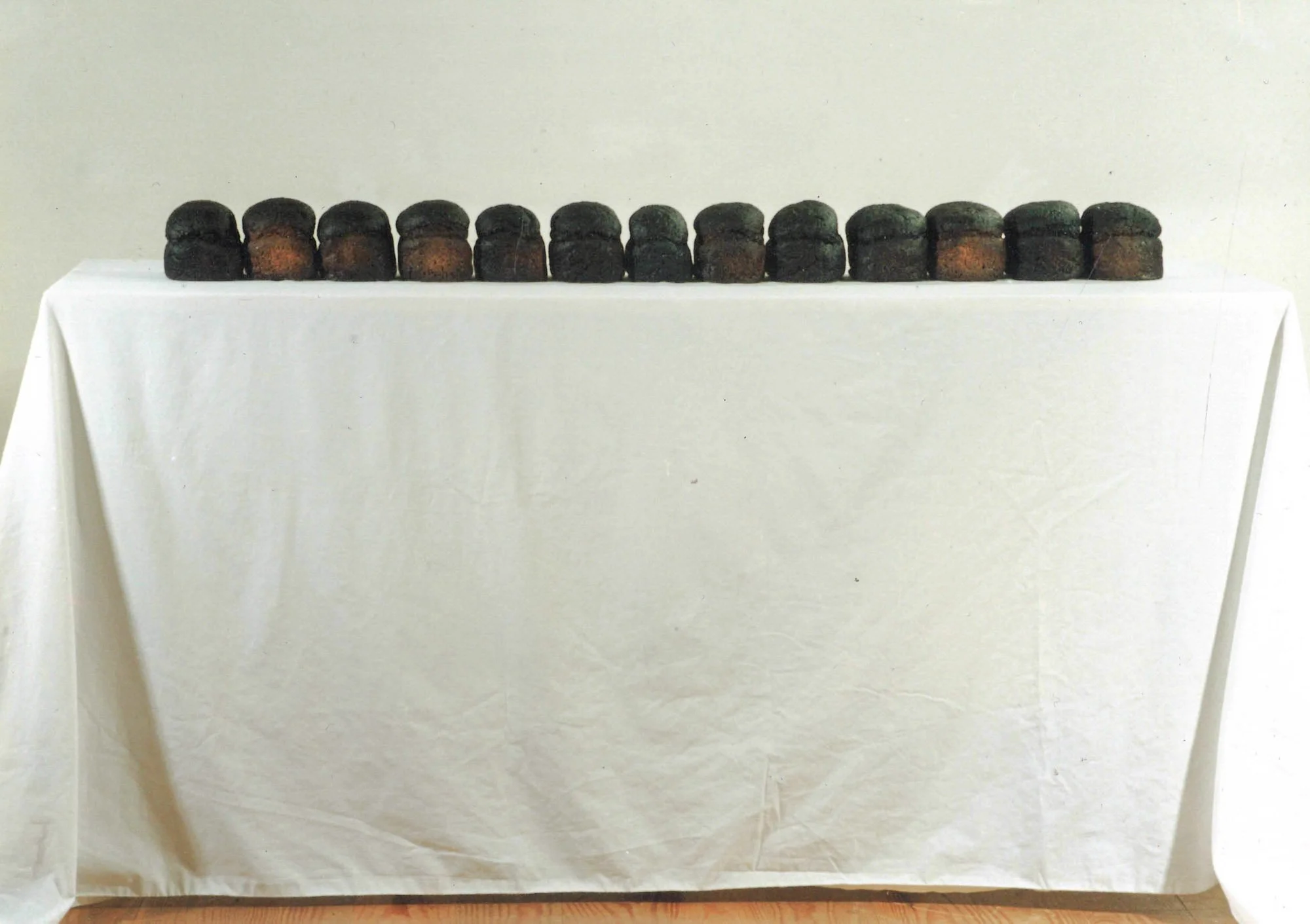  Altar , 1995, 13 preserved loaves, 86x100x40cm