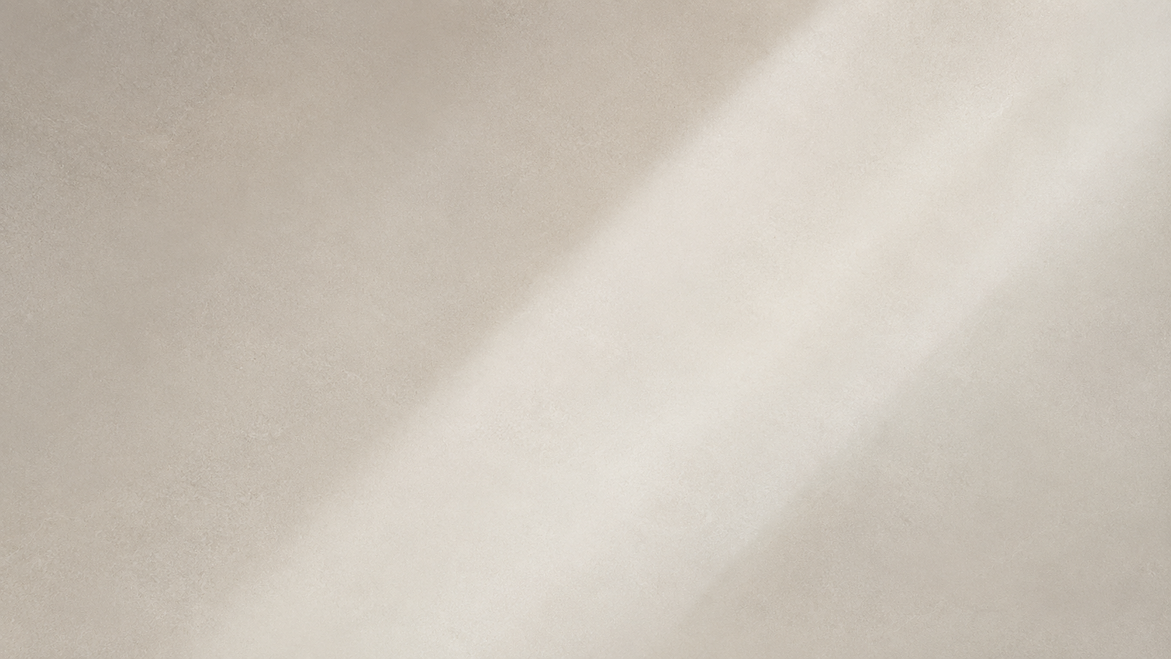 Close-up of a ceiling with a shadow cast by a window or object.