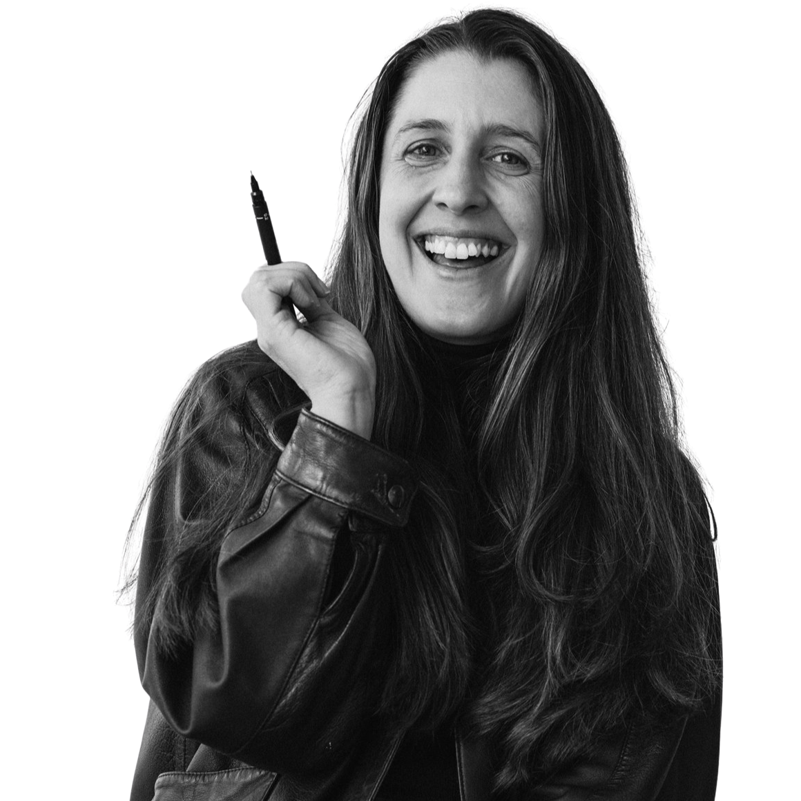 Kate smiling and holding a pen, wearing a leather jacket.