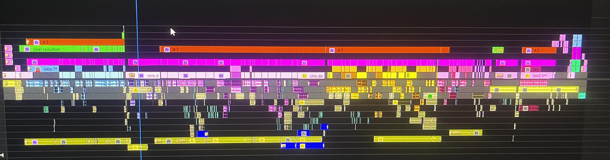 Screenshot of a digital audio editing timeline with multiple colored tracks and clips representing different audio segments.