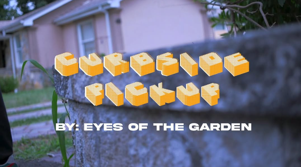 Title slide for 'Curfuffle' by Eyes of the Garden, with 3D block-style text over a blurry garden scene background showing a house and a stone wall.