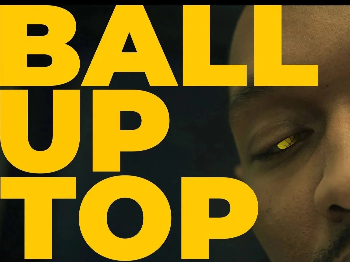 Close-up of a person's face with a basketball in their eye, overlaid with the bold yellow text 'BALL UP TOP'.
