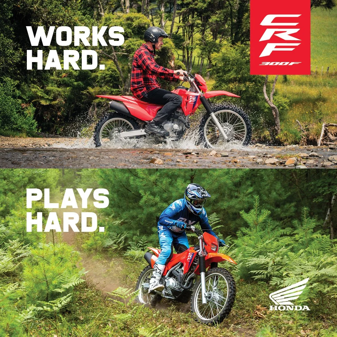 Two separate images of off-road motorcycle riders. The top image shows a rider in a red plaid shirt and helmet riding across a shallow creek with trees in the background, with the text 'WORKS HARD.' The bottom image shows a rider in blue gear and helmet riding through dense green foliage, with the text 'PLAYS HARD' and the Honda logo.