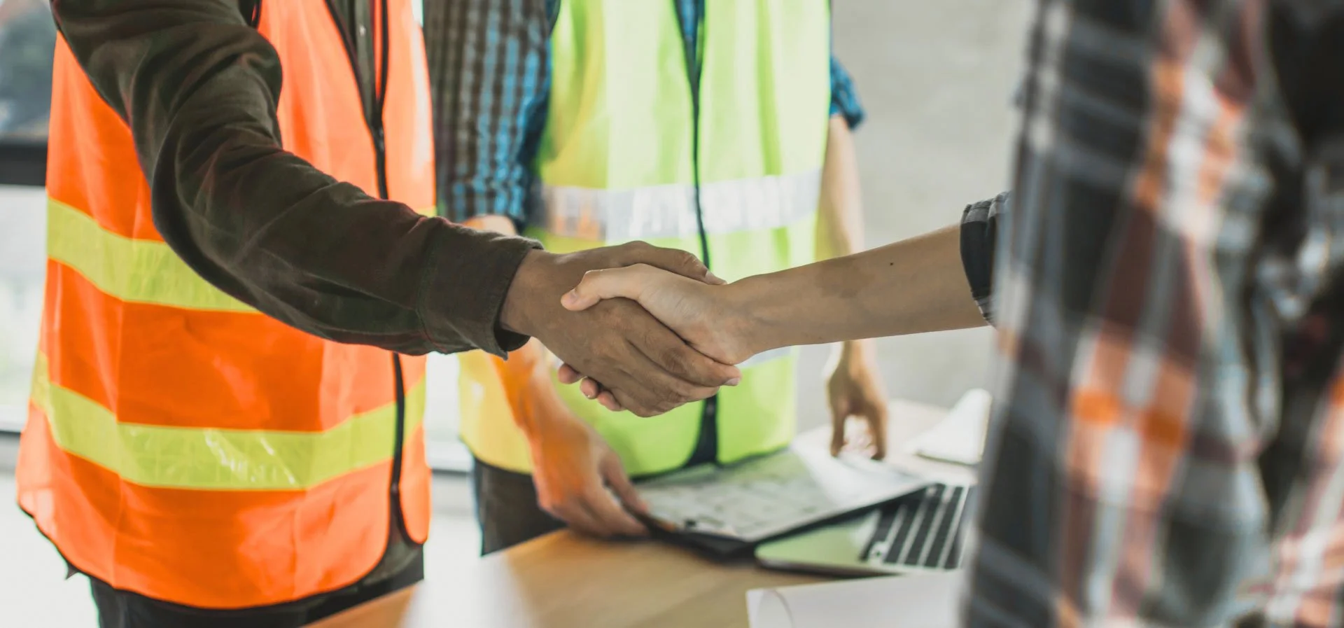 Two individuals shaking hands