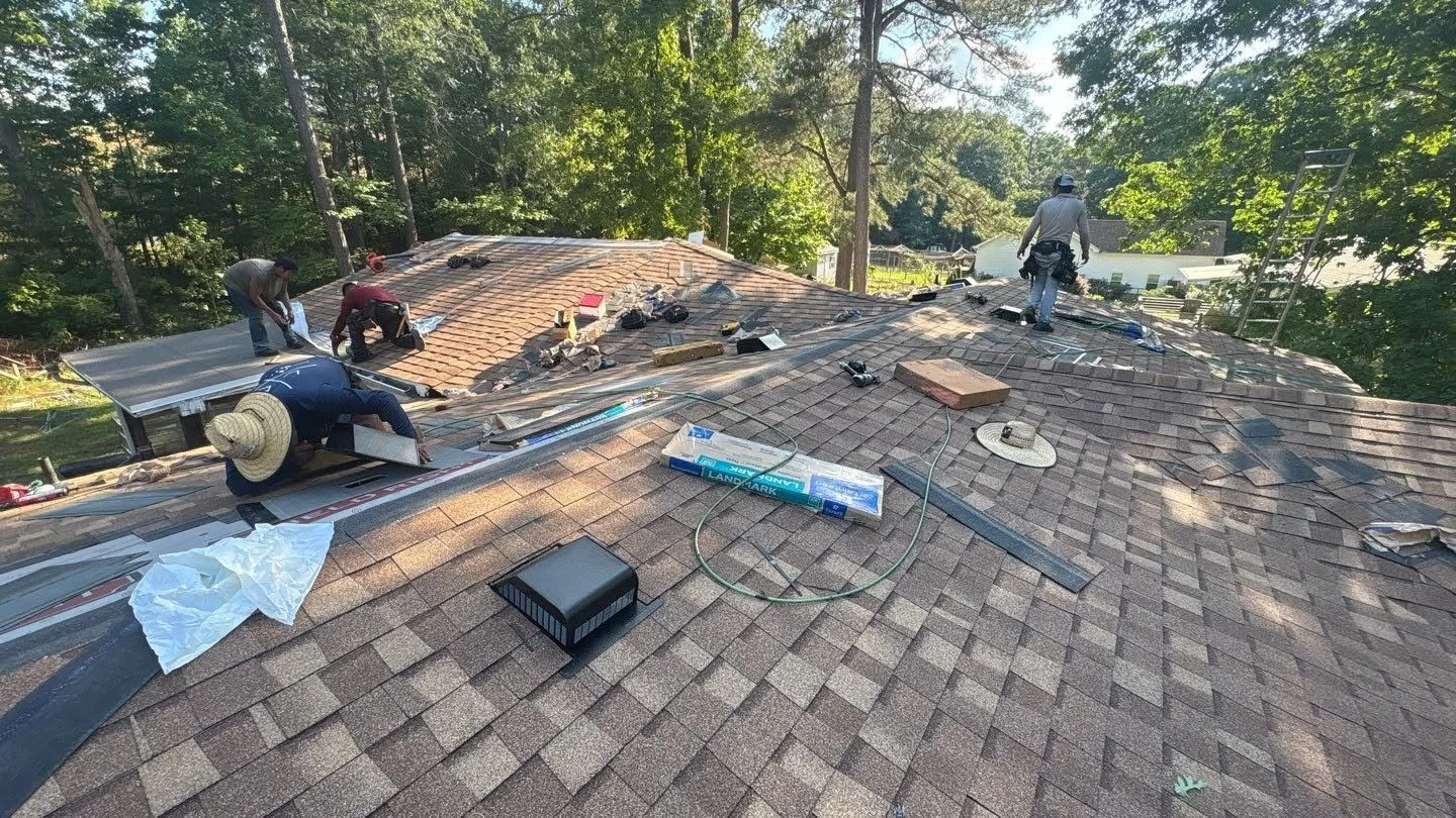 Crew working hard on a roof replacement