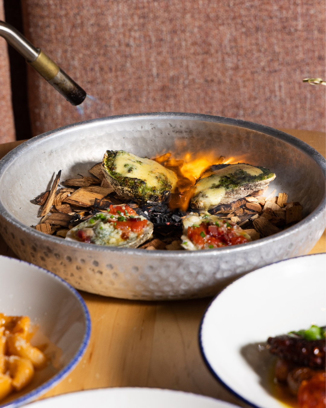 Fire-kissed and made for sharing. 🔥🦪

Wood-fired oysters, best enjoyed together at #KindlingChicago