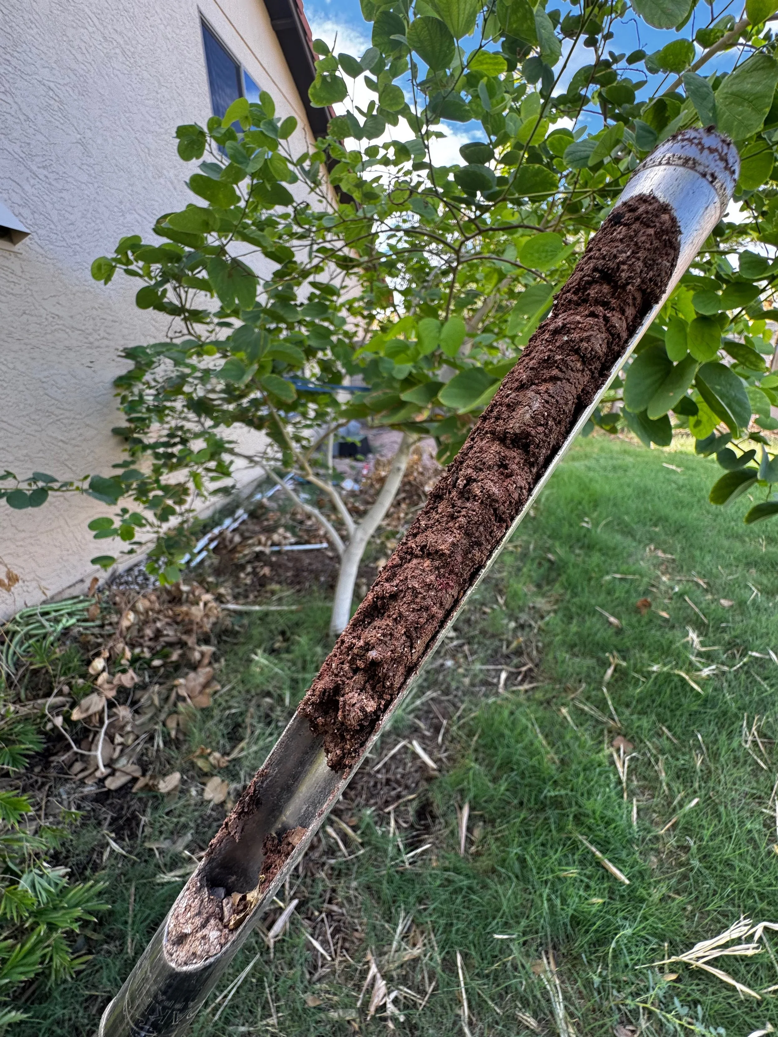 Soil probe holding a core sample pulled from the ground