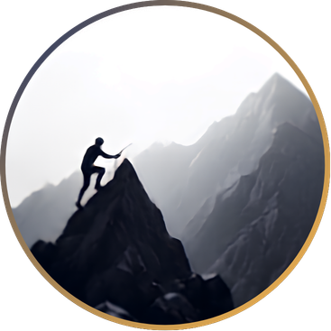 Silhouette of a person climbing a mountain during dusk or dawn on a rocky mountain landscape.