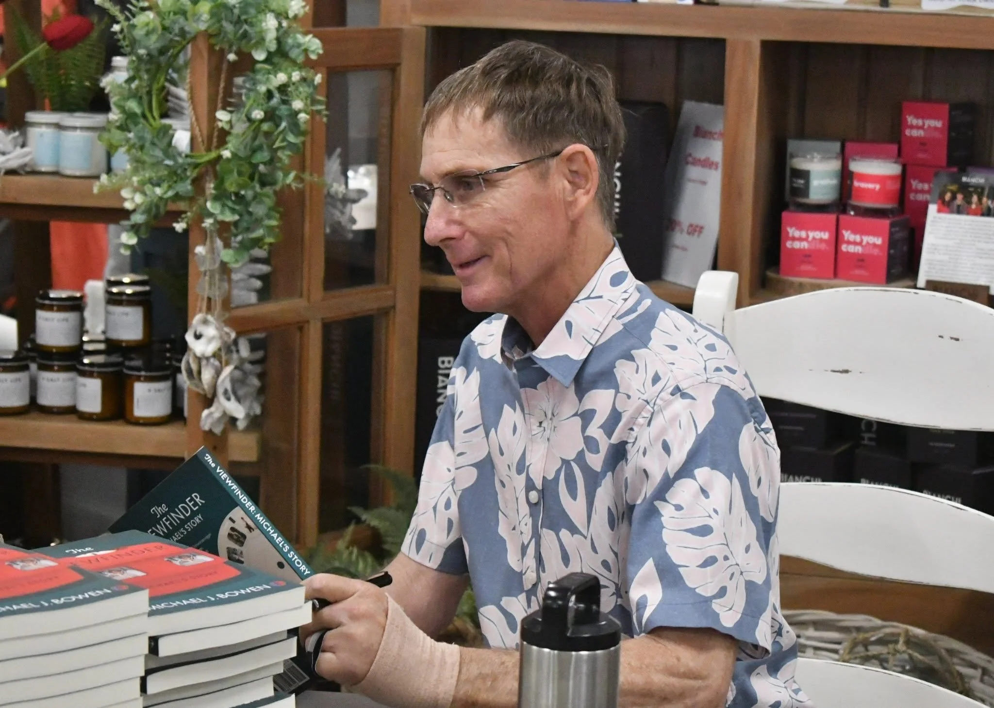 Michael J. Bowen in a book signing event smiling