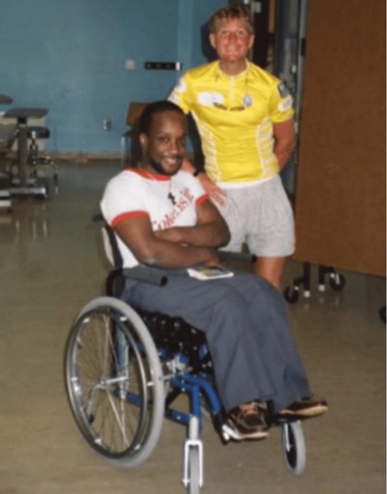 Michael J. Bowen visiting a patient in a rehabilitation center.