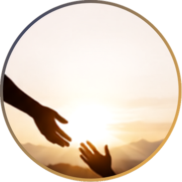 Two hands reaching towards each other against a sunset background.