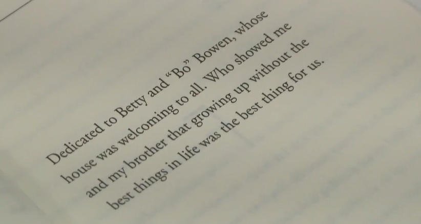 Close-up of a page from Michael J. Bowen's book with a dedication to Betty and Bo — his parents.