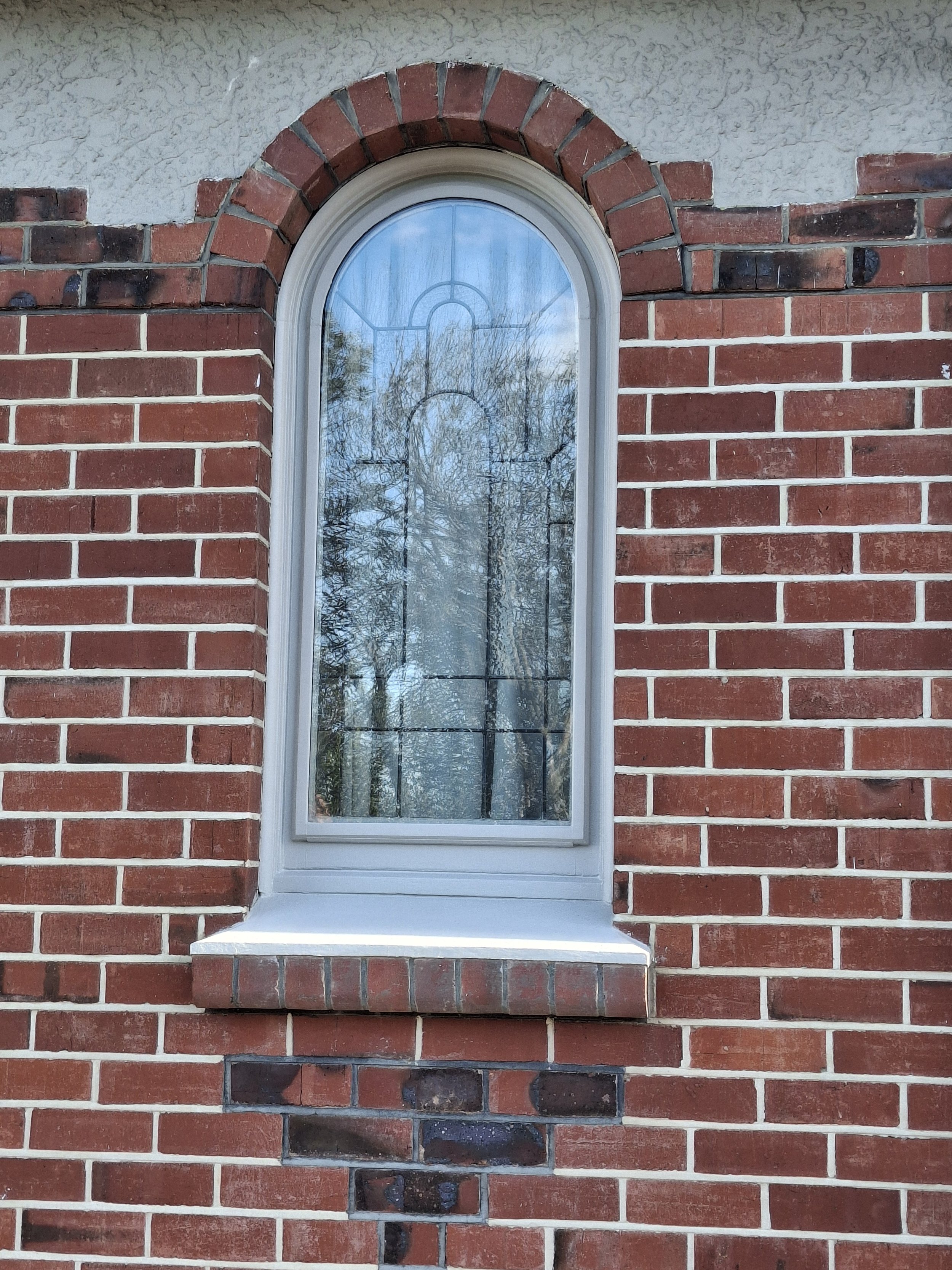 Curved window retro fit double glazing. Warm home.