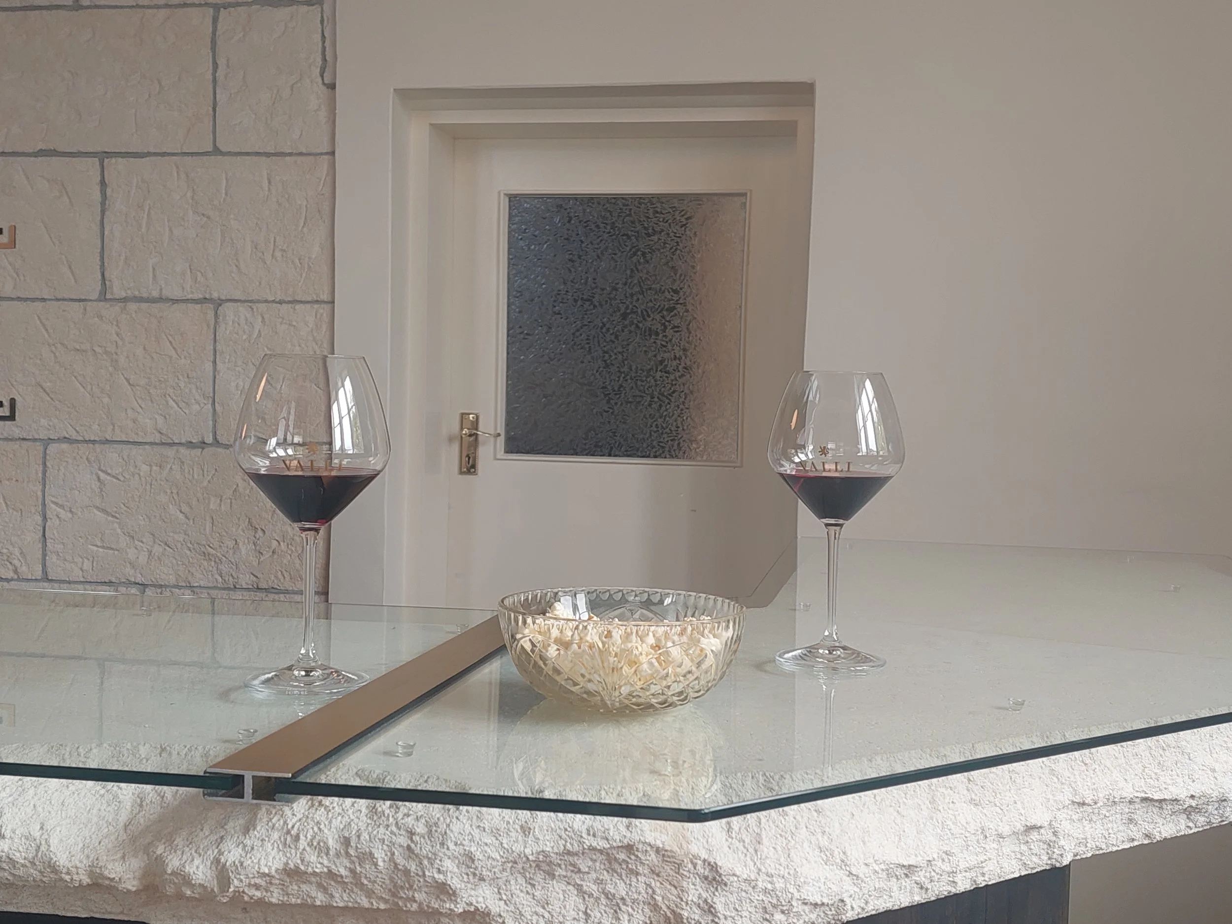 Custom made glass table top, custom laminate glass in door. Splash back.
