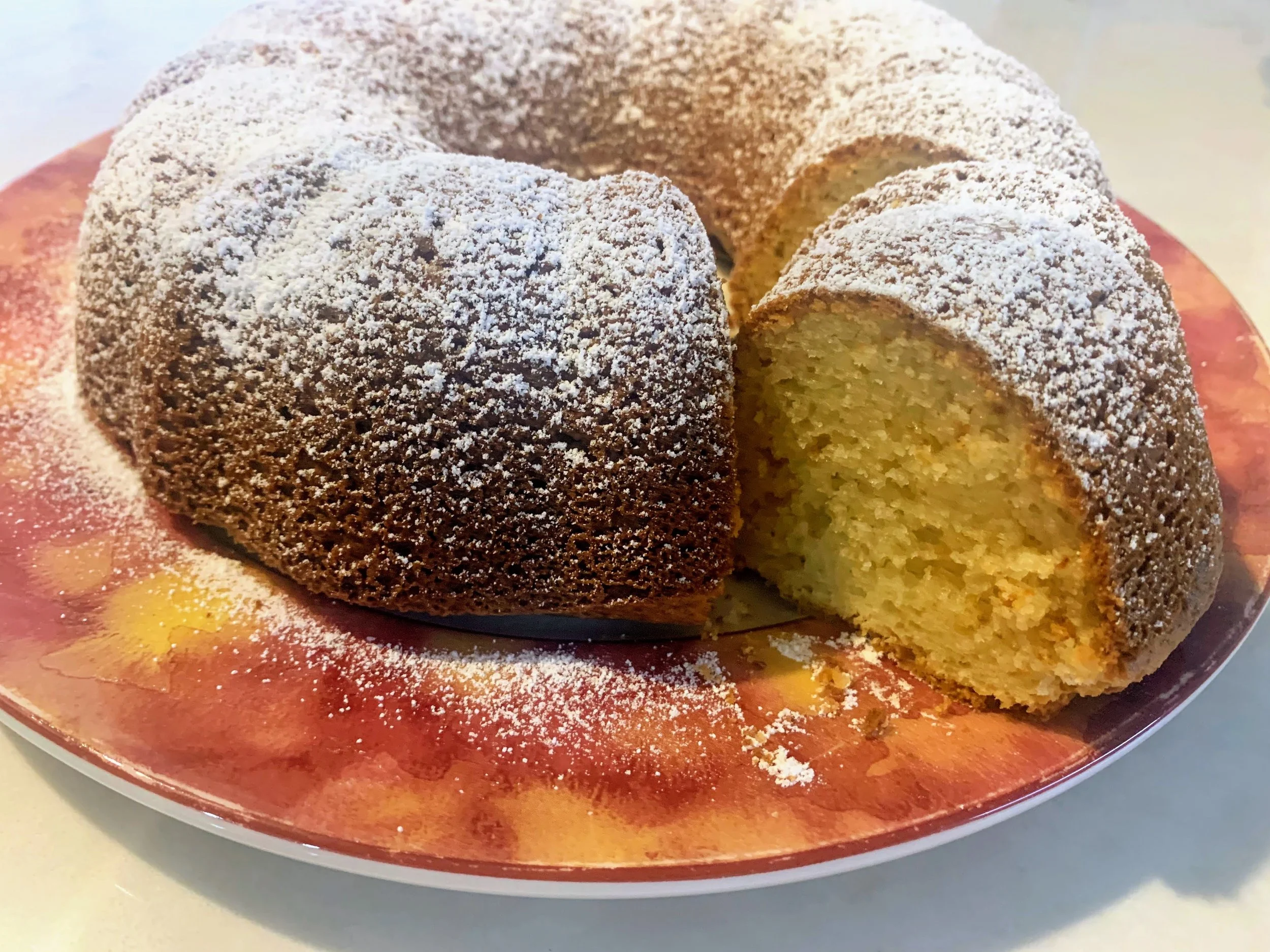 Slice of Gluten-Free Ciambella  - Traditional Italian Tea Cake lightly dusted with Icing
