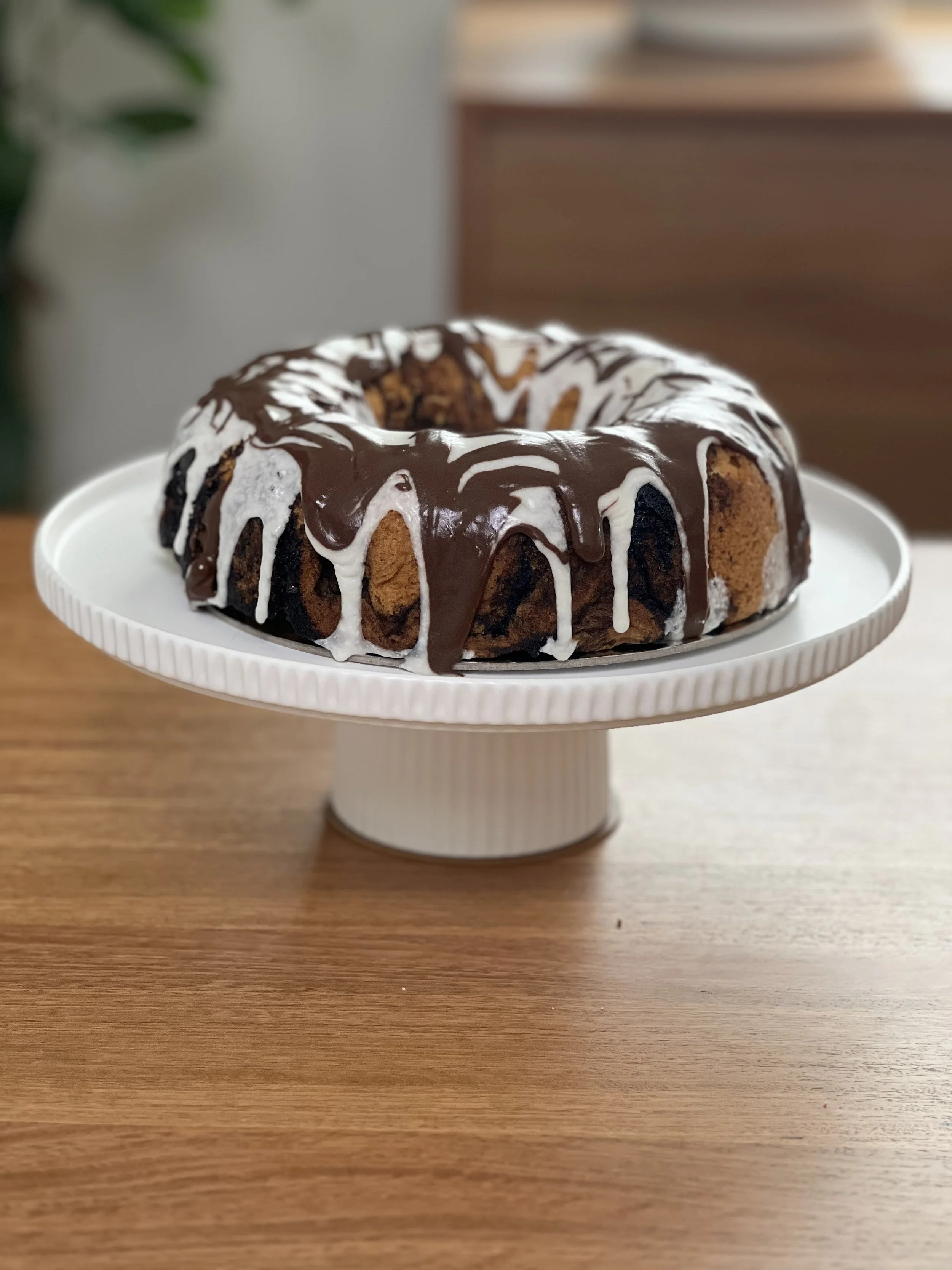 Gluten-Free Chocolate & Vanilla Marble Cake covered in Chocolate and Vanilla Ganache