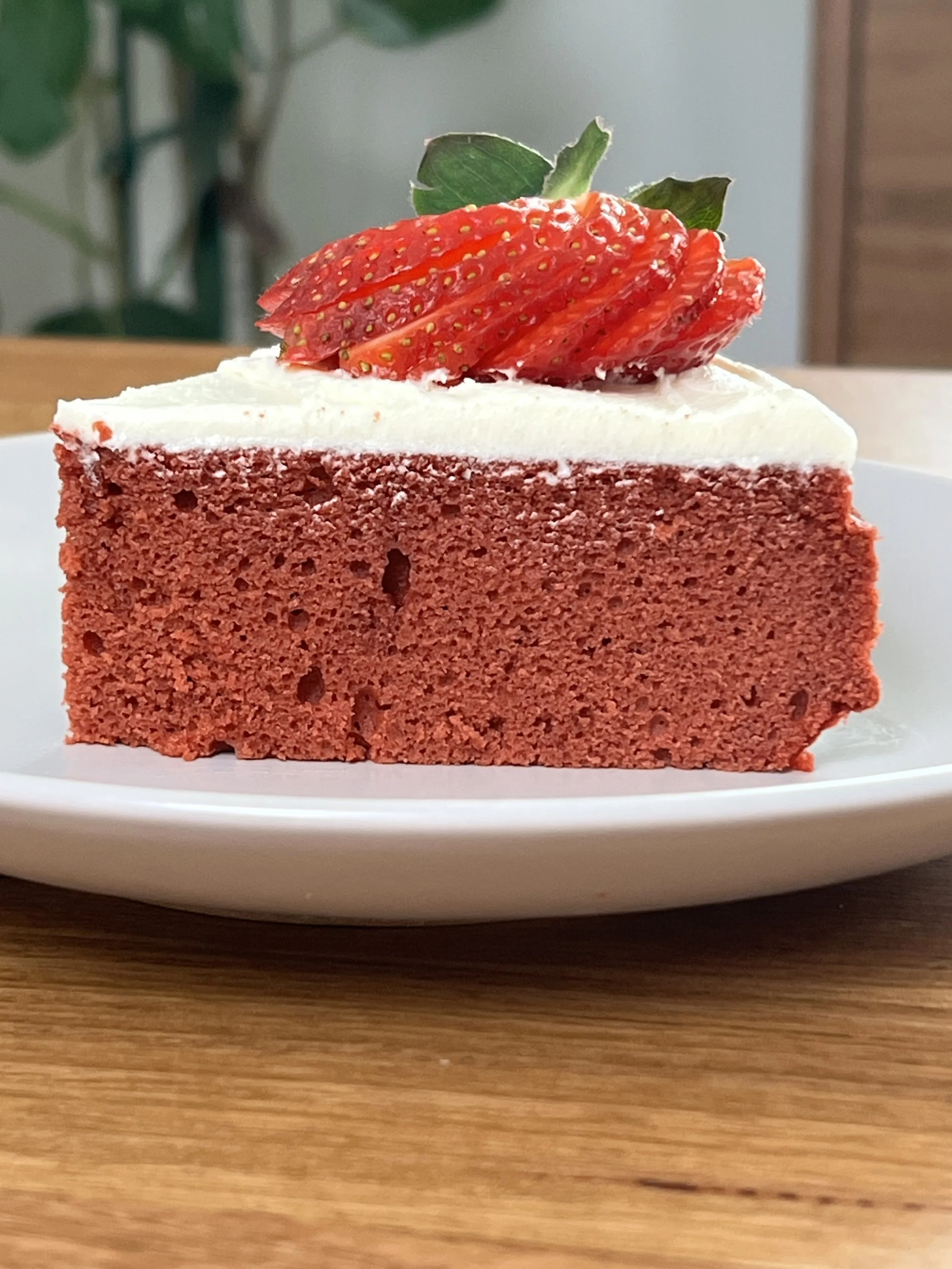 Slice of Gluten-Free Red Velvet Cake with Vanilla Icing
