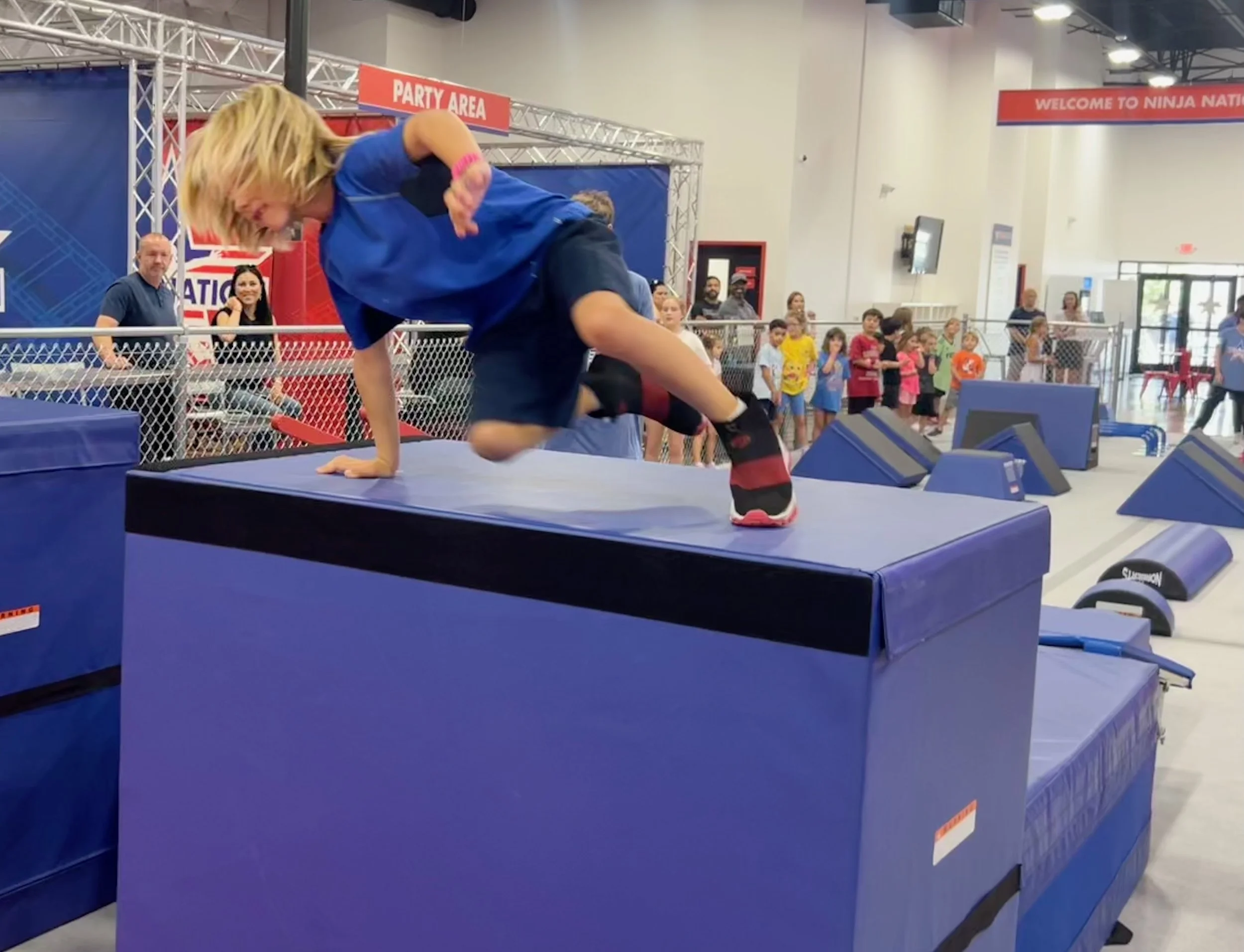Child racing through an obstacle during a birthday party at Octo Ninja in Austin