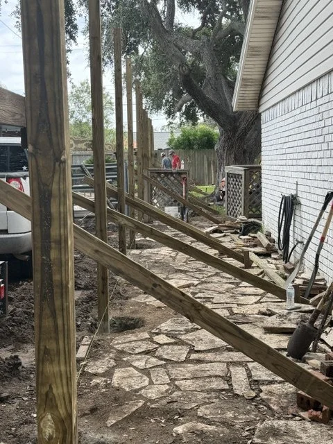 Construction in progress for a stone pathway adjacent to a house, Residential Privacy