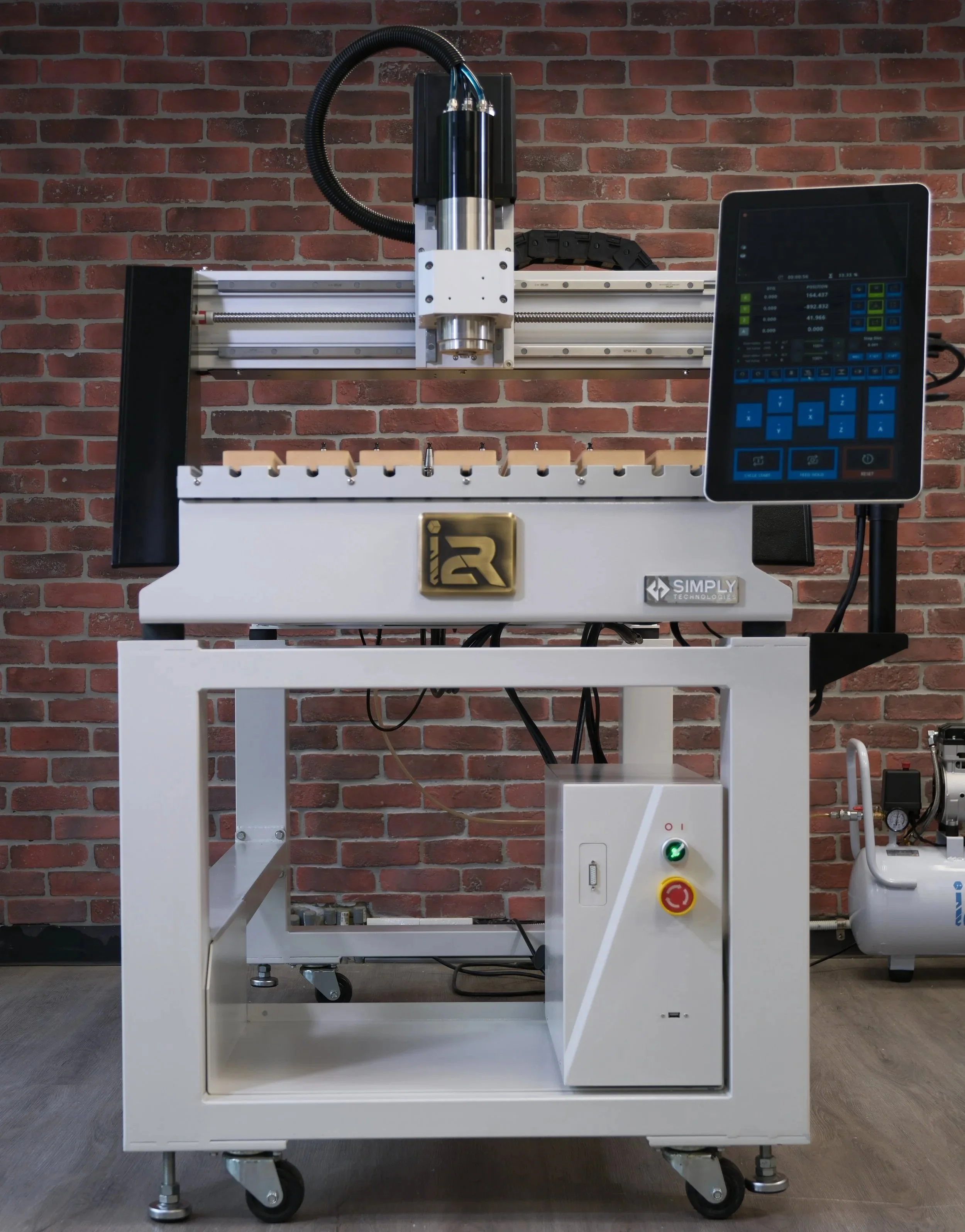 "i2R A.24 CNC router with steel frame and aluminum T-slot table with a 6 tool holder slot auto tool changer.