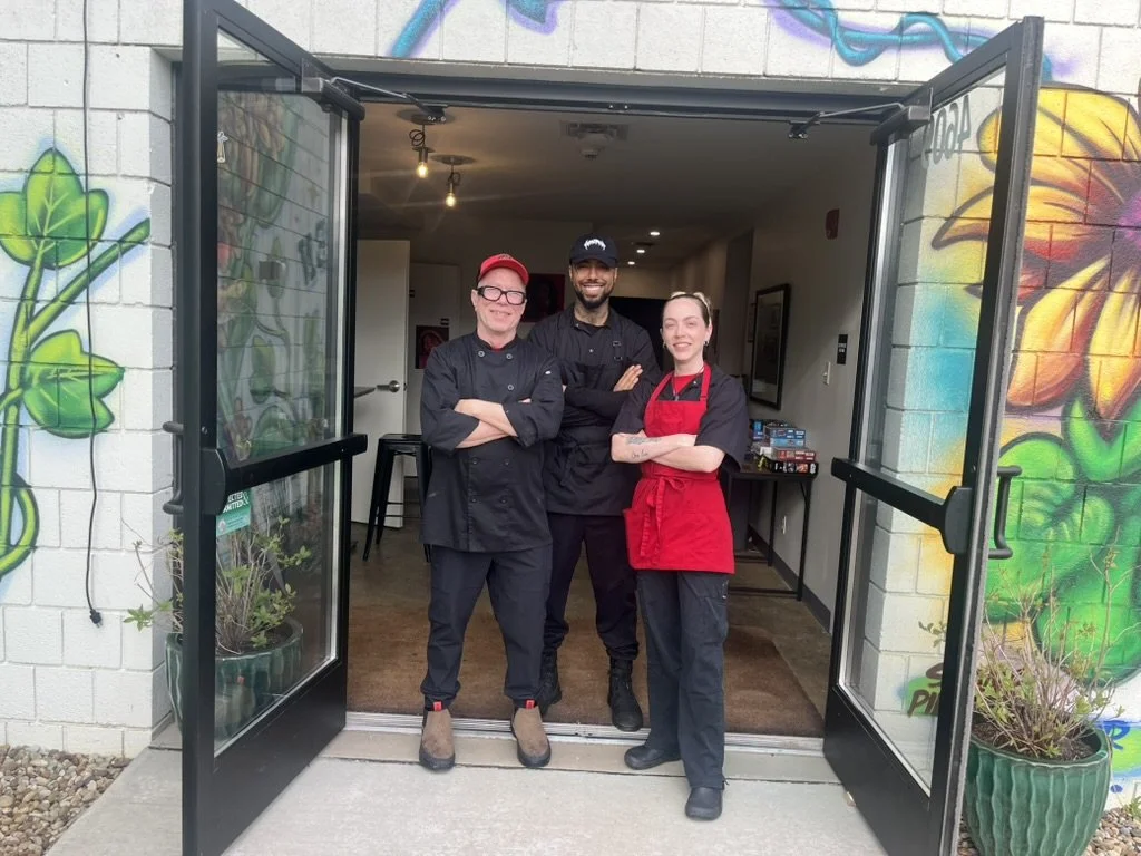 Comfort & Spice's catering team standing in a doorway