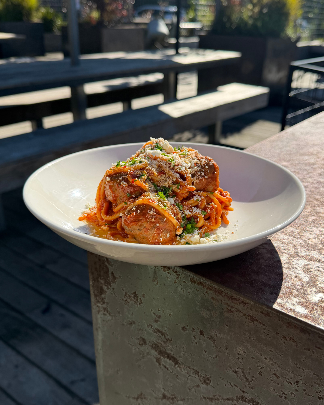 Italian style lamb meatballs w. ricotta cheese, Napoli sauce, spaghetti, parmesan & chilli oil