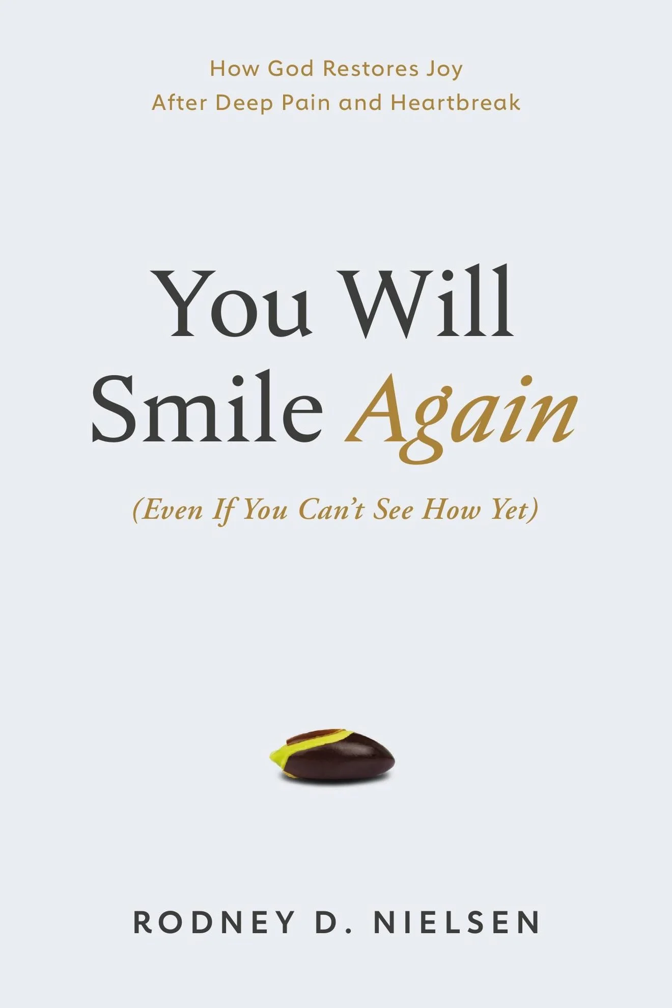 Book cover: 'You Will Smile Again (Even If You Can't See How Yet)' by author and pastor Rodney D. Nielsen. Subtitle: How God Restores Joy After Deep Pain and Heartbreak. The cover is white except for a small seed beginning to grow.