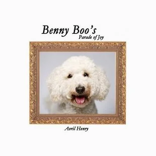 Book cover titled 'Benny Boo's Parade of Joy' by Avril Henry, featuring a fluffy white dog inside an ornate gold frame.