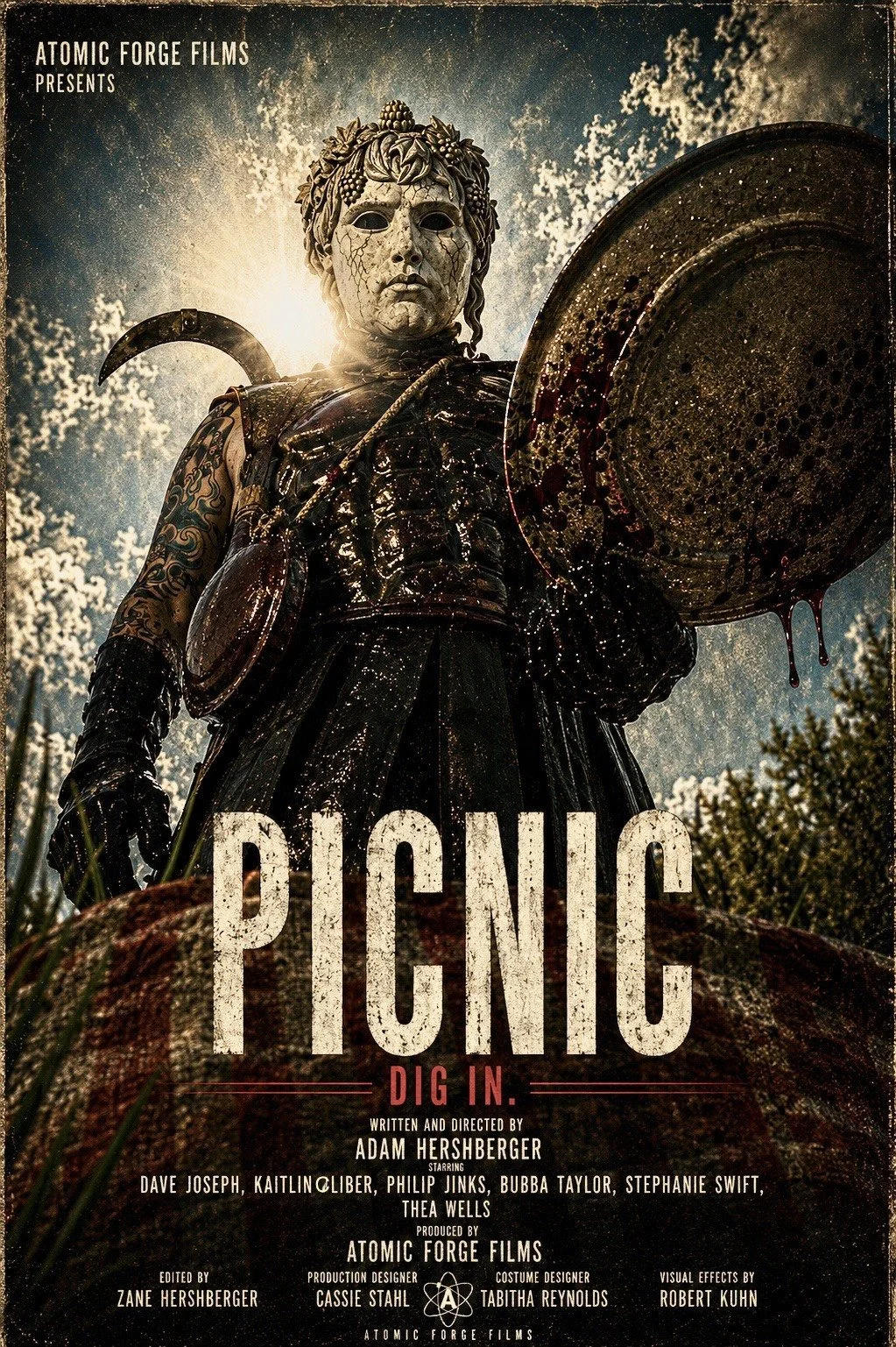 A promotional poster for a horror film titled "Panic" features a terrifying statue of a woman holding a bloody large plate. The statue has a cracked white face mask and dark costume, set against a cloudy sky with the sun backlighting it. The poster includes text with the film's cast and crew, and the logo of Atomic Forge Films.