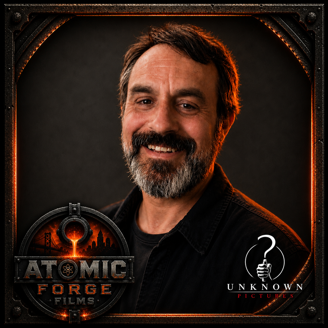 A smiling man with a beard and mustache, wearing a black shirt, against a dark background, in a frame with the logos of 'Atomic Forge Films' and 'Unknown Pictures'.