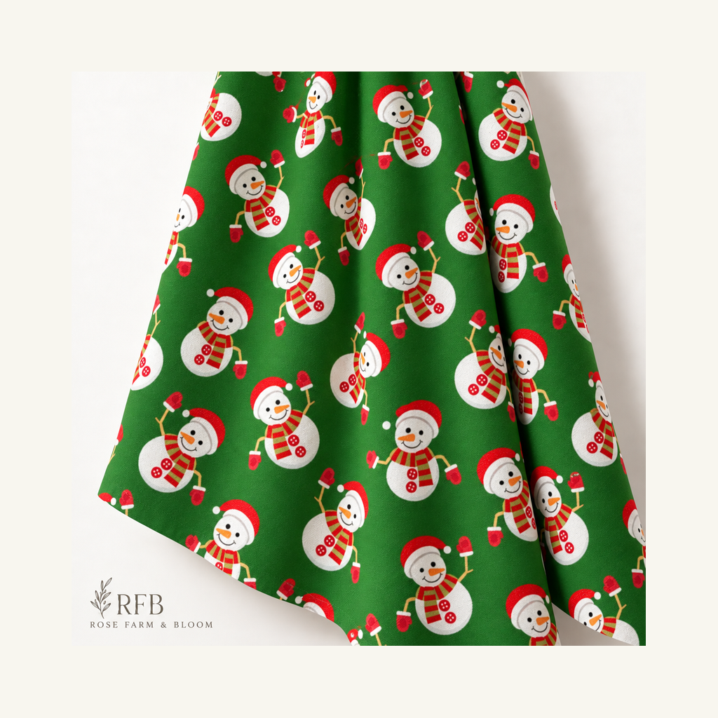 Christmas Waving Snowmen on Green - folded fabric