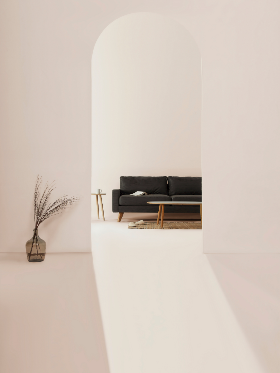 Beige living room area with a black couch