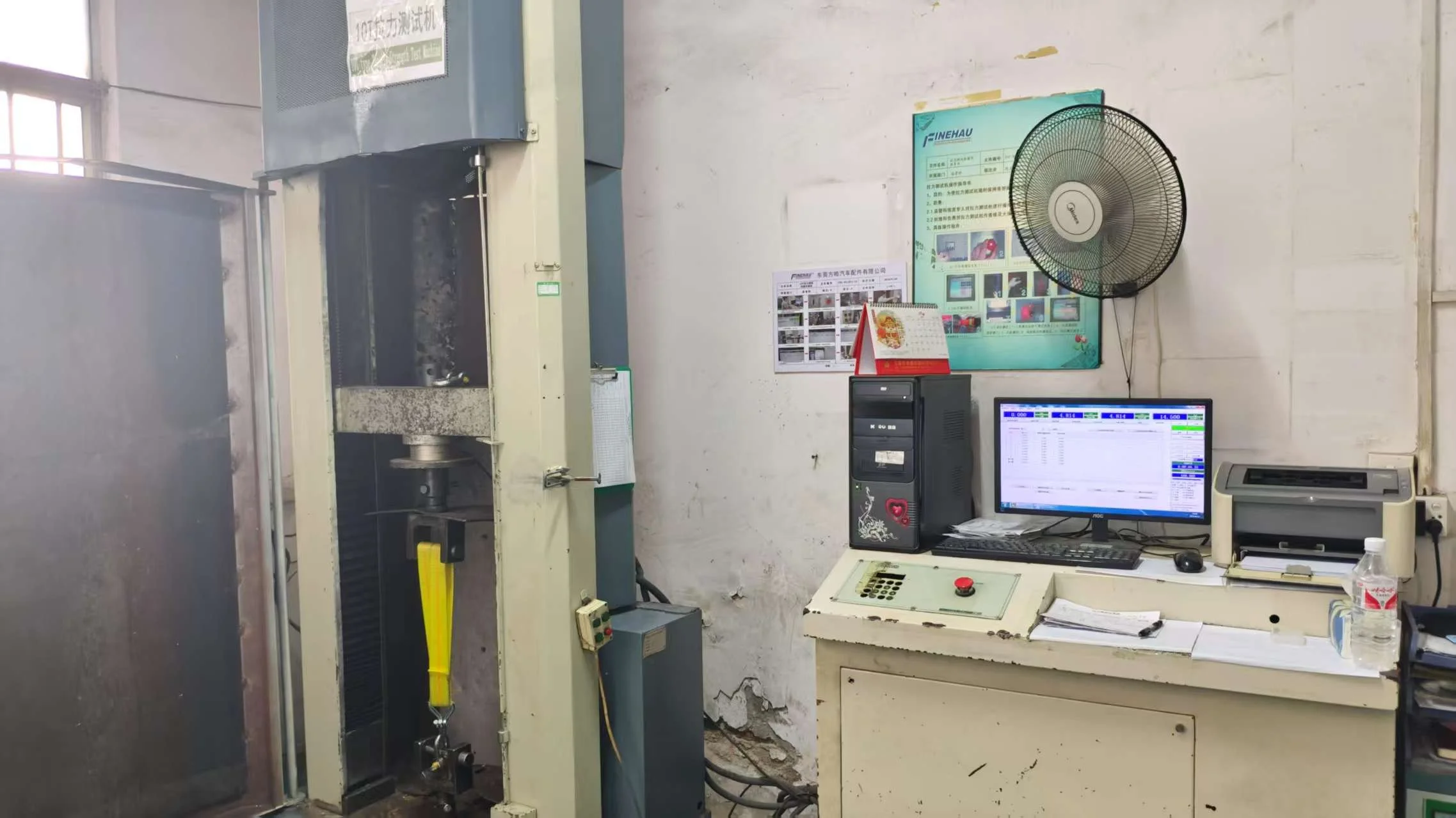 Tensile test machine to test the breaking strength of ratchet tie downs which ensure safety in transportation.